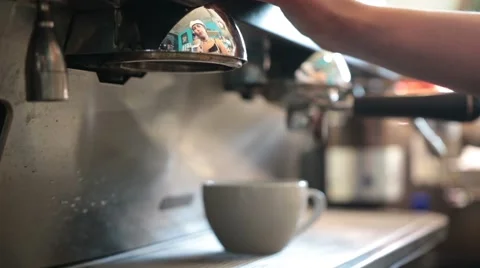 Young barista preparing coffee in a cafe Stock Footage 65760627