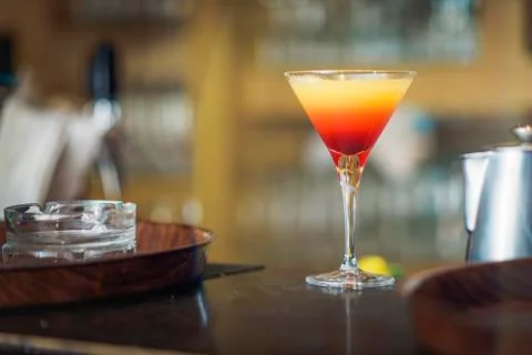 Young bartender or a waiter making a cocktail Stock Photos
