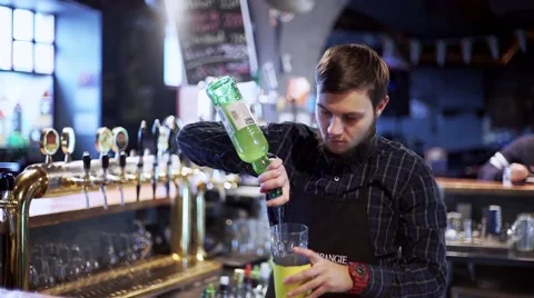 Young bartenderpreparing coctail with shaker Stock Footage 56465469