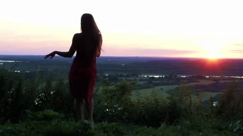 Young bautiful girl dancing in sunset Stock Footage 71369731