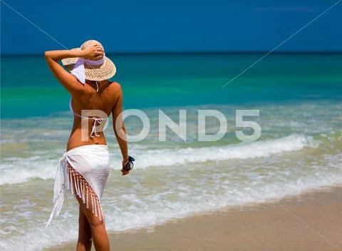 Young on a beach enjoying the sun Stock Photos