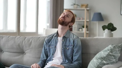 Young Beard Man Sleeping Sitting on Couch Video stock 95665006