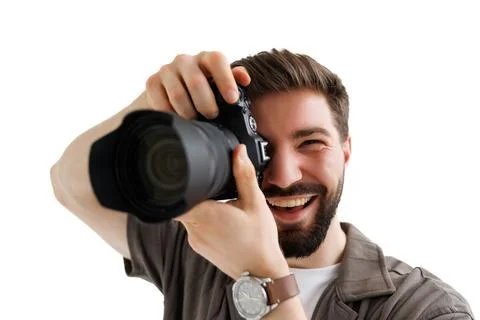 Young bearded camera man hold camera isolated on white background Stock Photos