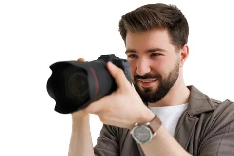 Young bearded camera man hold camera isolated on white background Stock Photos