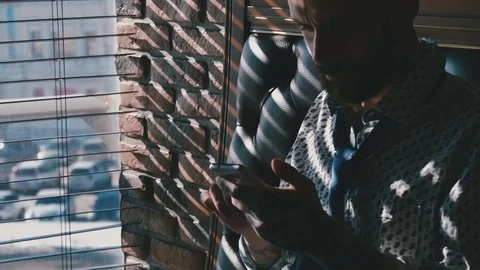 Young bearded guy with phone Stock Footage 76950964