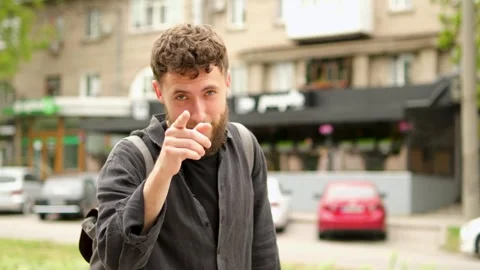 Young bearded guy shows emotion - think. Stock Footage 279741411