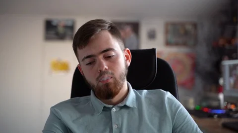 Young bearded guy smokes marijuana. Look down Vidéo 127864344