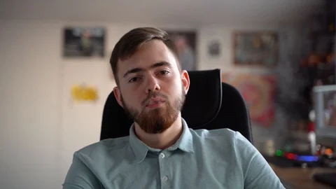 A young bearded guy smokes marijuana. 库存影片 127864346