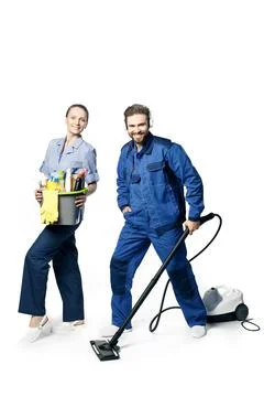Young bearded handsome guy and a girl in a uniform of cleaners are isolated o Stock Photos