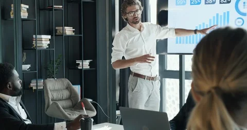 Young Bearded IT worker standing by the Glass Board with different Notes Stock Footage 124287152