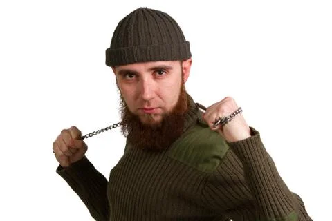 A young bearded man with chain on a white Stock Photos