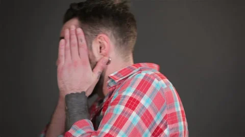 Young bearded man expressing shock Stock Footage 251462930