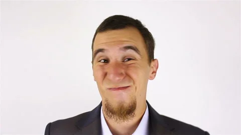 Young bearded man expression shows emotions in front of the camera. fool around 스톡 동영상 92507885