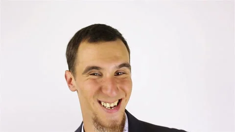 Young bearded man expression shows emotions in front of the camera. fool around Stockbeeldmateriaal 92508872