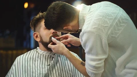Young Bearded Man Getting Haircut By Barber. Barbershop Theme Stock Footage 70951153