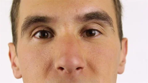 Young bearded man looking at camera and winks Stock Footage 92445927