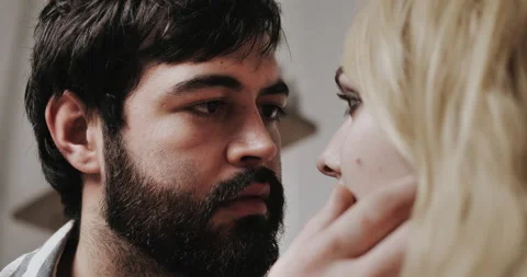 Young bearded man looking with love at pretty young white heared woman  Video stock 148895962