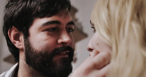 Young bearded man looking with love at pretty young white heared woman  Video stock 148895973
