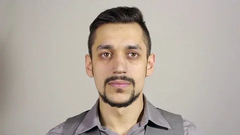 A young bearded man makes a loud statement, gesture Stock-Footage 75348678
