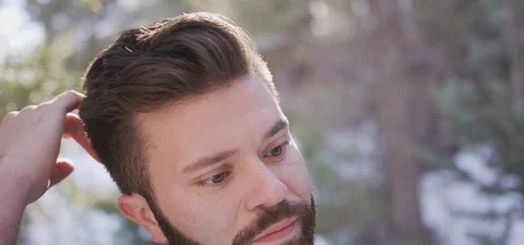 Young Bearded Man puts his Hands through is Hair Stock Footage 87265982