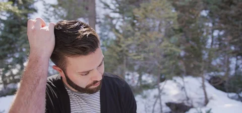 Young Bearded Man puts his Hands through is Hair Medium Shot Stock Footage 87266029