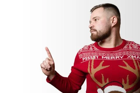 Young, bearded man showing something. Empty space, isolated on white backgrou Stock Photos