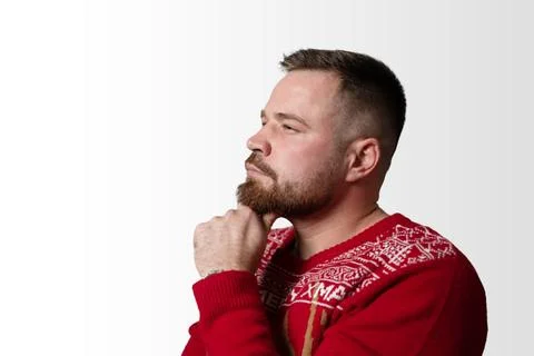 Young, bearded man thinking about something. Isolated on white, copy space Stock Photos