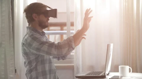Young bearded man wearing virtual reality glasses Stock Footage 120823839