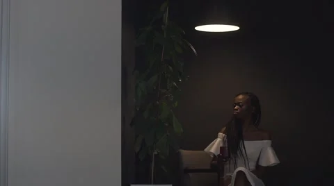 Young beautiful african american female fashion model drinking from red Stock Footage