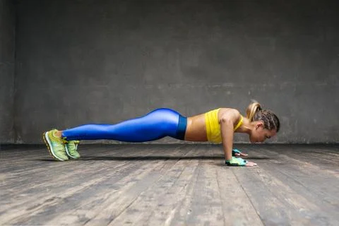 Young beautiful athlete is posing in studio Stock-Fotos