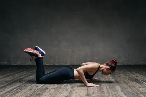 Young beautiful athlete is posing in studio Stock Photos
