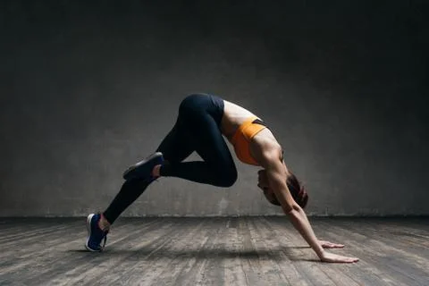 Young beautiful athlete is posing in studio Stock Photos