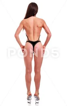 Young beautiful athletic girl with sexy body in bikini. Isolated Stock Photos