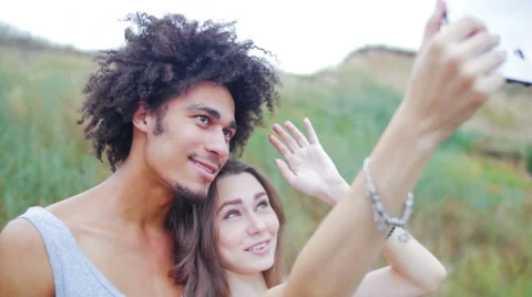 Young, beautiful, attractive, different racial man and woman doing photo Stock Footage 57106947