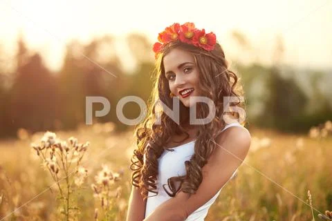 Young, beautiful, attractive model in swimsuit, posing in a fiel Stock Photos