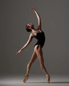 Young beautiful ballet dancer is posing in studio Stock Photos