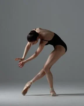 Young beautiful ballet dancer is posing in studio Stock Photos