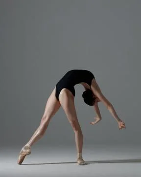 Young beautiful ballet dancer is posing in studio Stock Photos