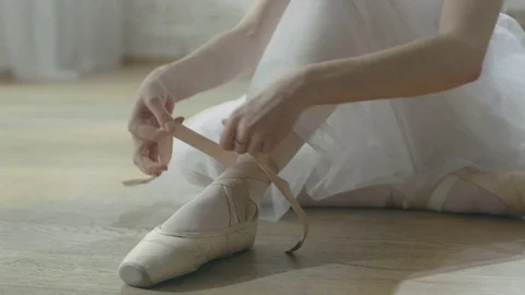 Young Beautiful Ballet Dancer Sitting on the Wooden Floor in Her Tutu Dress Stock Footage 71625265