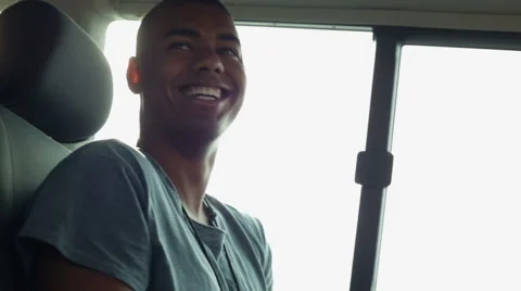 Young beautiful black man during a travel in a moving van Vídeo Stock 64520178