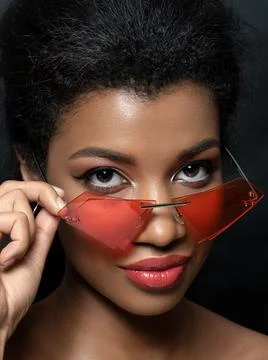 Young beautiful black woman wearing red sunglasses Stock Photos
