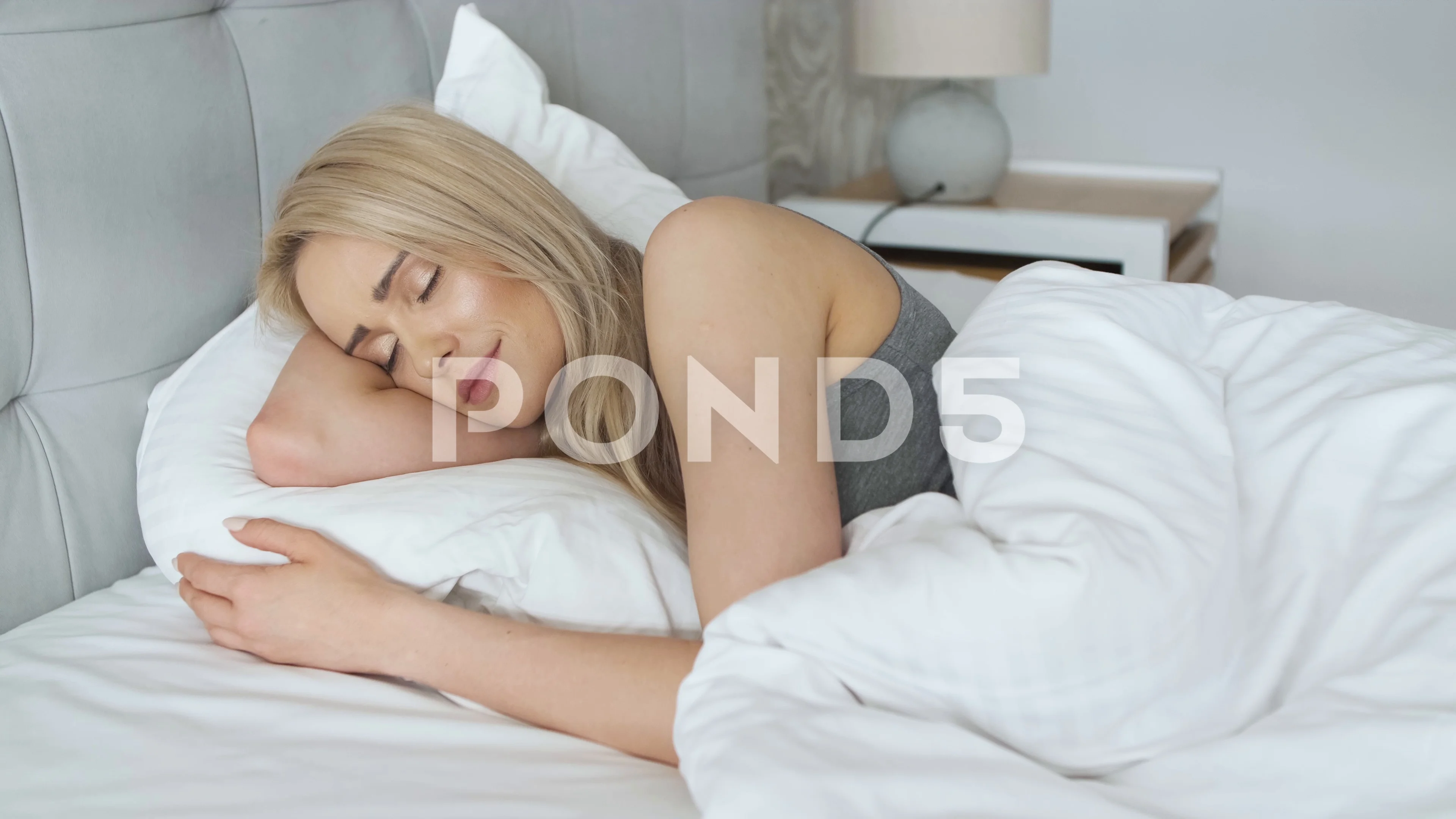 Young beautiful blonde woman sleeping in, Stock Video
