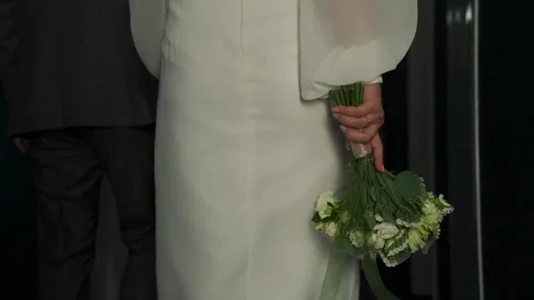 A young beautiful bride strokes herself with her hand Stock Footage 328370282