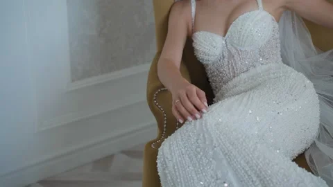 A young beautiful bride strokes herself with her hand Stock Footage 329249225
