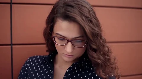 Young beautiful business woman reading office documents standing next to Stock Footage