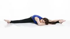 Young beautiful yoga woman is posing in studio Stock Photo