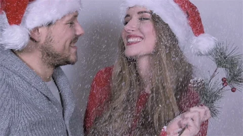 Young beautiful Christmas couple in studio. Slow motion. Stock Footage 44447342