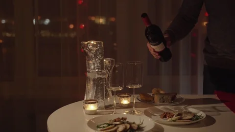Young beautiful couple having romantic dinner at home Stockbeeldmateriaal 99645199