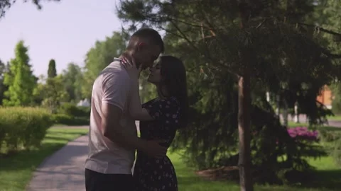 Young beautiful couple hugging on sunset background Stock Footage 112247482