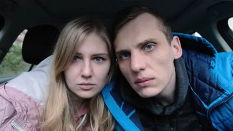 Young beautiful couple looking at the camera and waving head disapprovingly Vídeo Stock 132276995